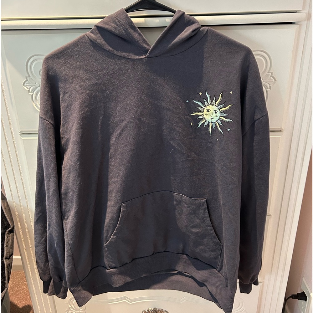 sweatshirt from macys with a sun and moon, size medium in women’s.